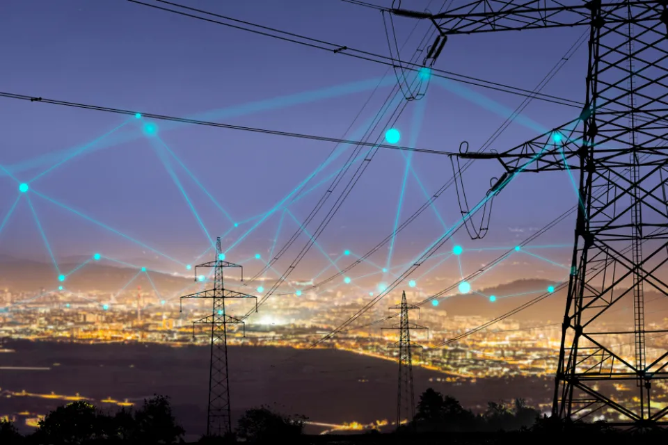 A grid of connected energy, shown as an imagined web over the night sky of an unnamed city.